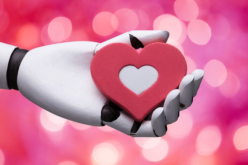 AI Robot hand holding a clay heart