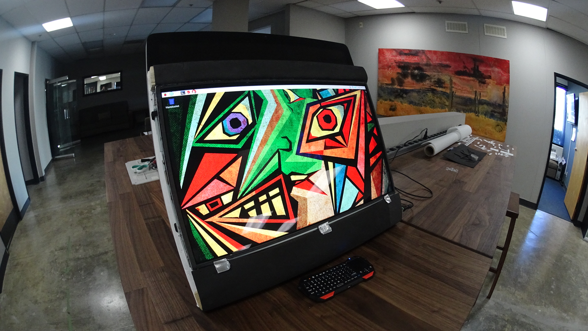 Art displayed on computer screen with opaque film